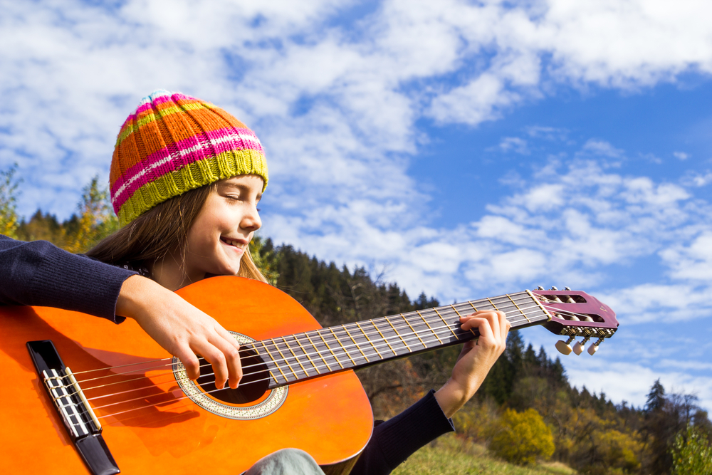 Play life music. Children playing Guitar. Play the Guitar. Playing the Guitar. Children Play the Guitar.